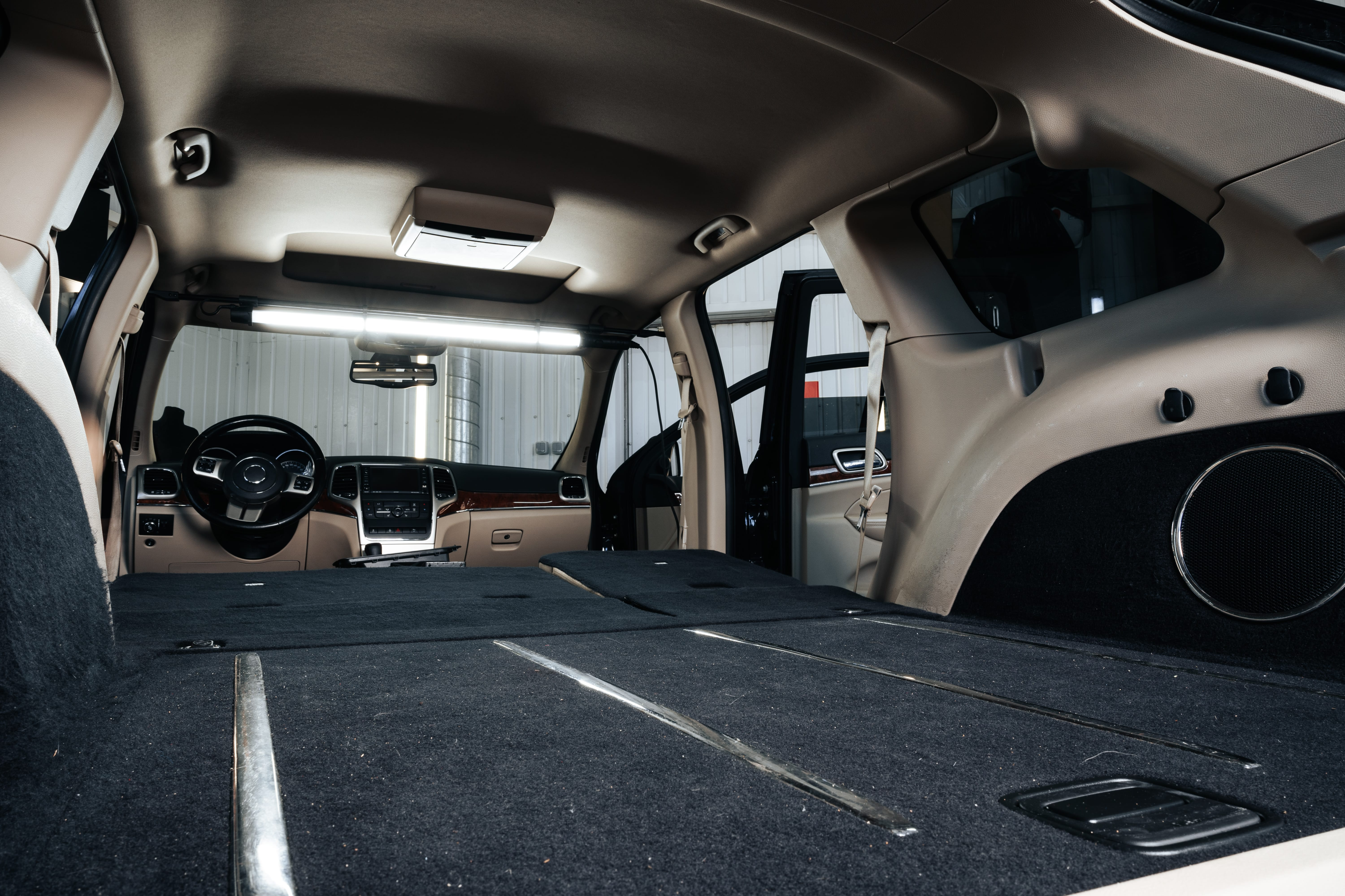 Custom trunk audio enclosure with a subwoofer