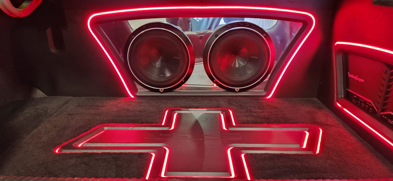 Red lit dual subwoofer trunk build