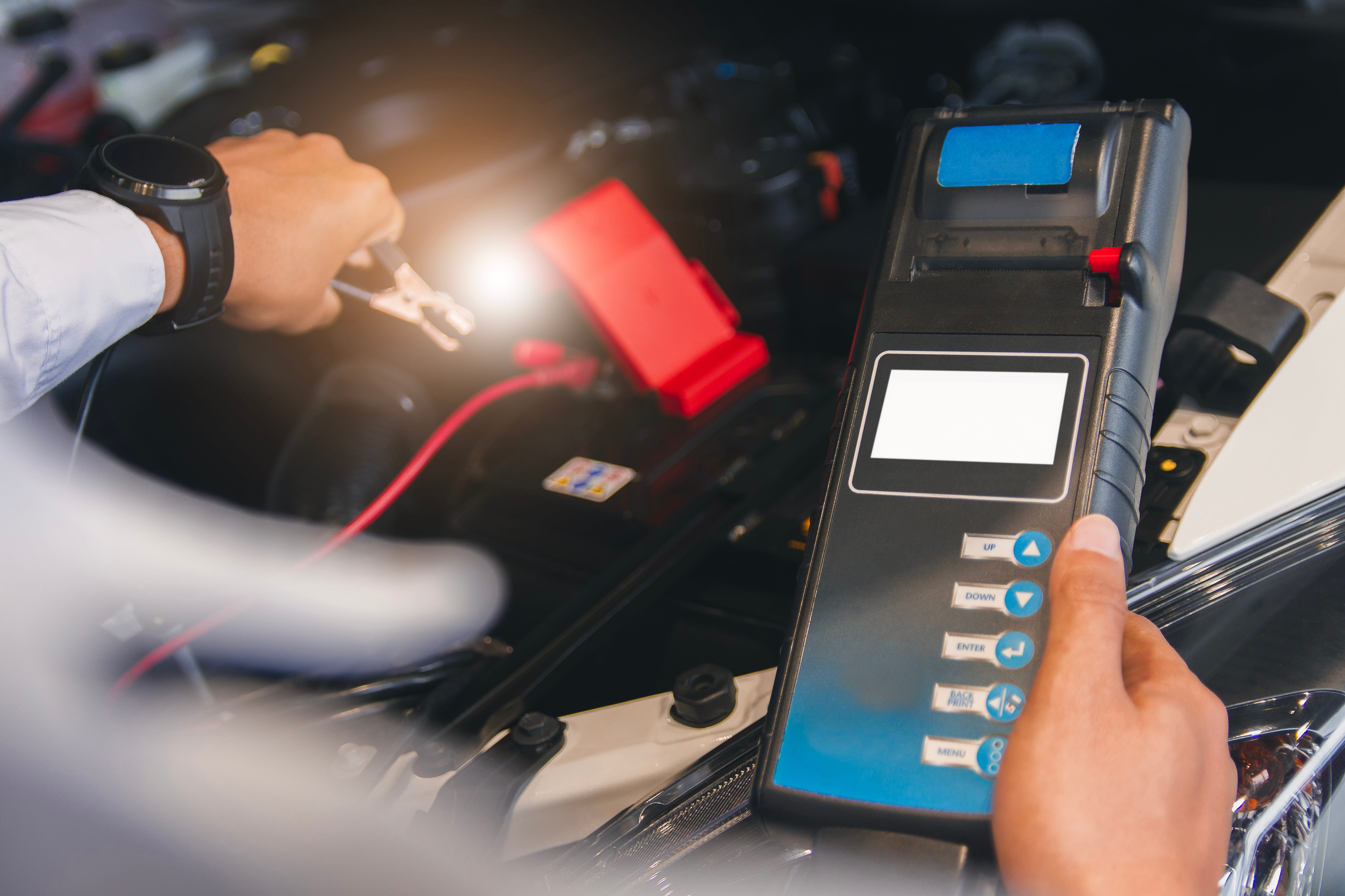 Technician using a vehicle diagnostic tool