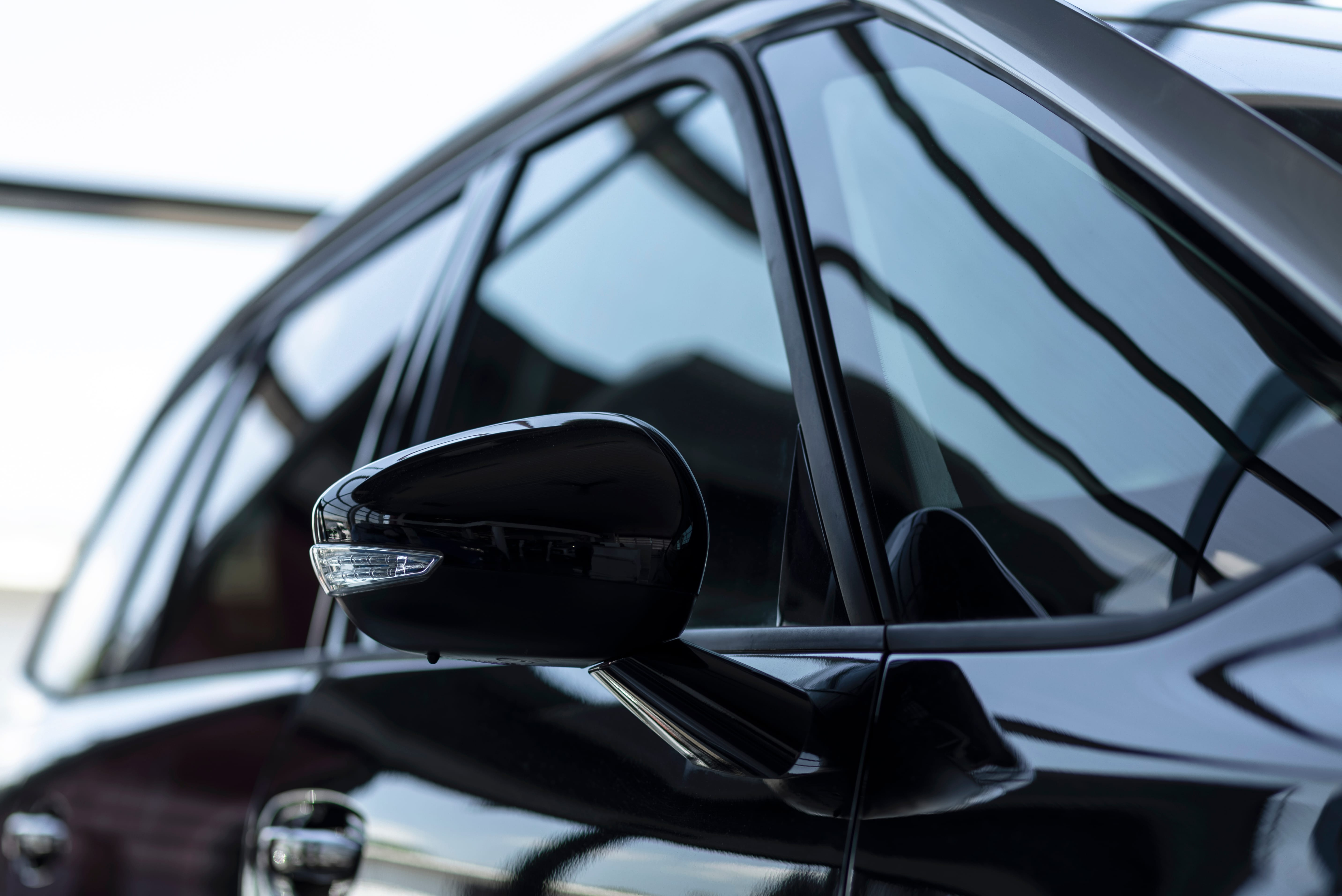 Dark-tinted vehicle side windows
